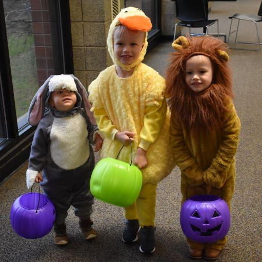 3 little kids in lion, duck & bunny costumes